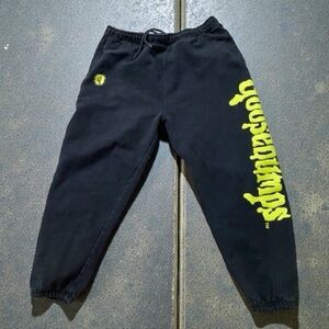 Dumbgood x Goosebumps black sweatpants featuring yellow graphic Medium
